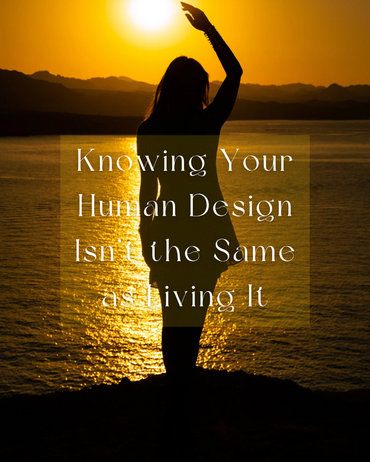 Silhouette of a woman standing by water at sunset, symbolizing embodied self-awareness and living Human Design through real life integration.